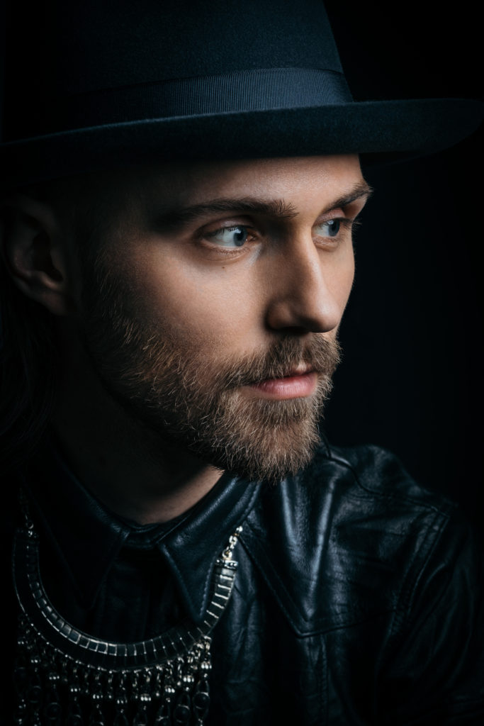 Photo of Lukas Meijer in a hat looking away from the camera